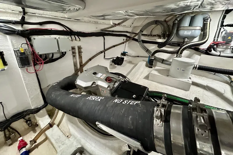 Slide: The Image of Engine room of 2023 Pardo Yachts 43, featuring Volvo Penta components and complex wiring. - 54