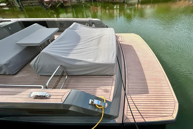 Slide: The Image of 2023 Pardo Yachts 43 with covered deck, docked on calm water. - 61