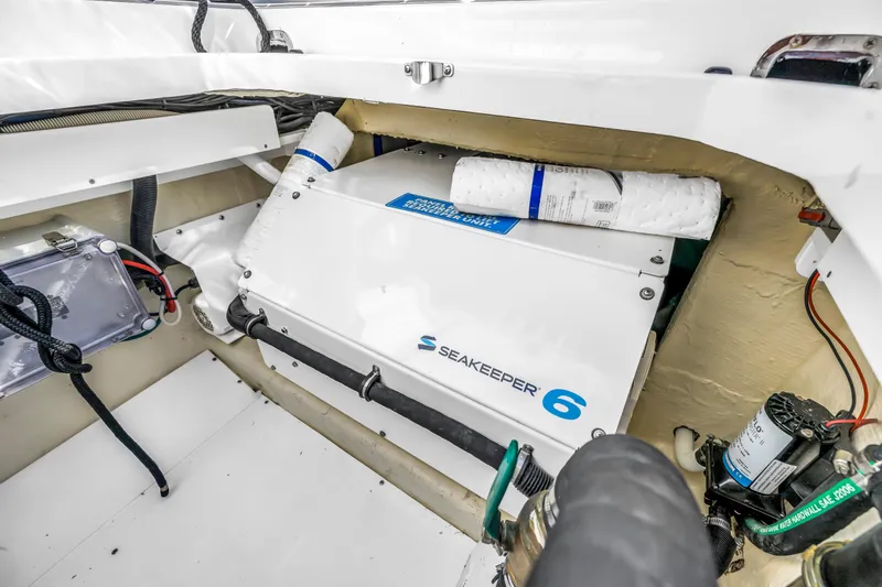 Slide: The Image of 2023 HCB 53 Suenos RXV boat featuring Seakeeper 6 stabilizer system in engine compartment. - 104