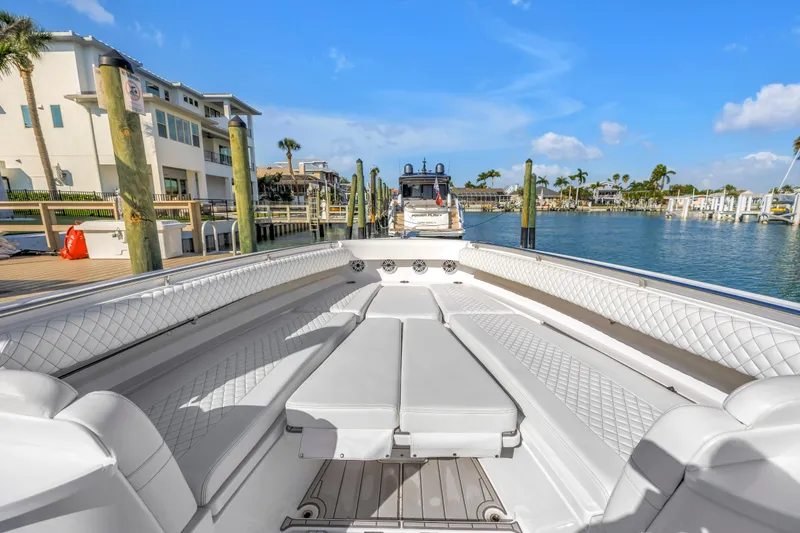 Slide: The Image of 2023 HCB 53 Suenos RXV luxury boat docked in a sunny marina. - 18