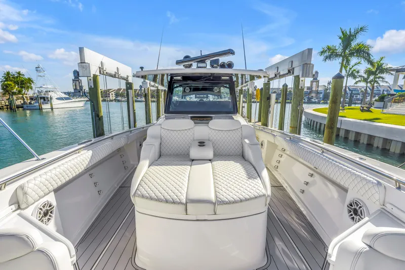 Slide: The Image of Luxurious 2023 HCB 53 Suenos RXV boat interior with plush seating and waterfront view. - 26
