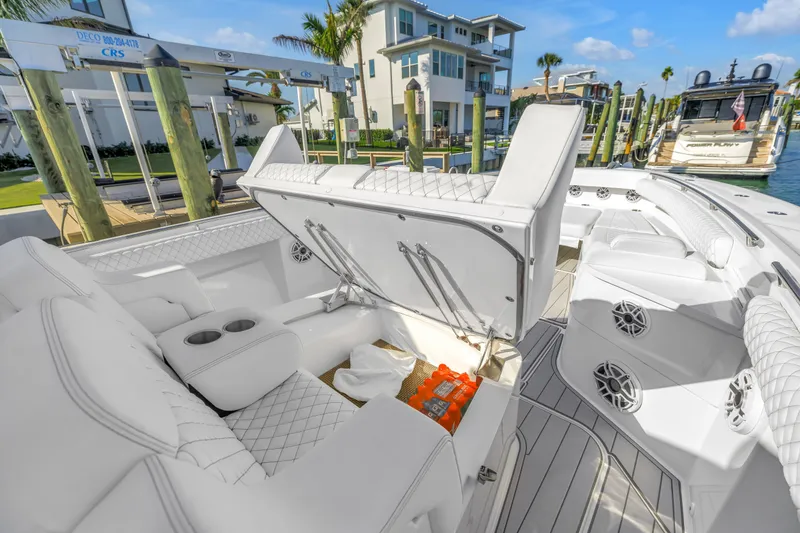Slide: The Image of 2023 HCB 53 Suenos RXV luxury boat interior with open storage compartment. - 31