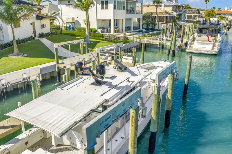 Slide: The Image of 2023 HCB 53 Suenos RXV docked in a scenic waterfront marina. - 35