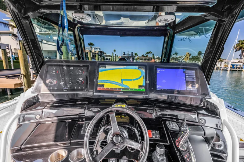 Slide: The Image of 2023 HCB 53 Suenos RXV boat dashboard with advanced navigation screens and controls. - 42