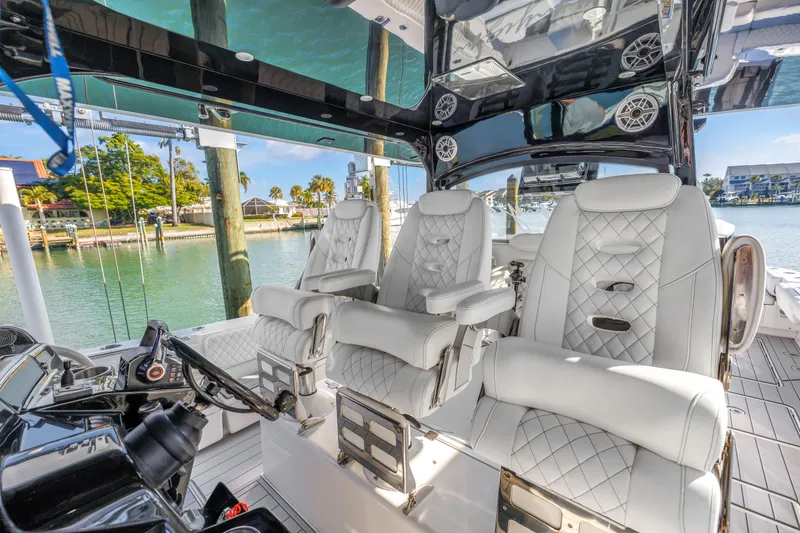 Slide: The Image of Luxurious interior of 2023 HCB 53 Suenos RXV boat with plush seating and modern controls. - 46