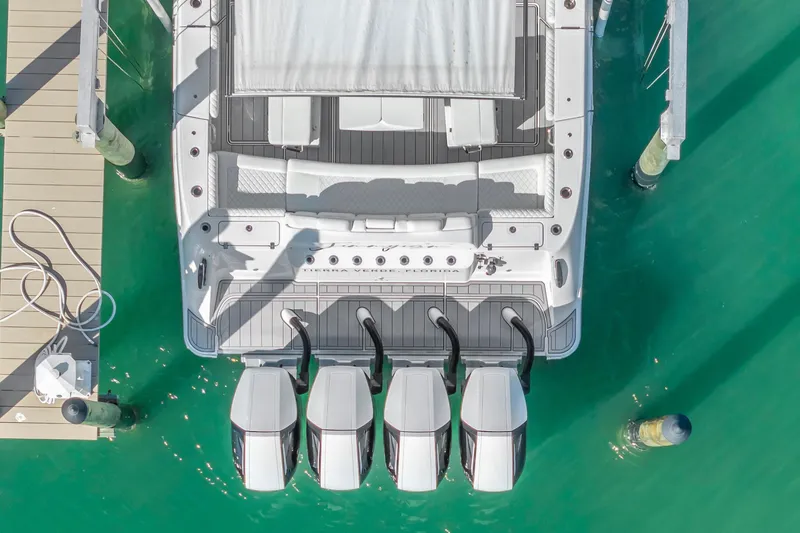 Slide: The Image of Aerial view of 2023 HCB 53 Suenos RXV boat docked with four engines. - 68