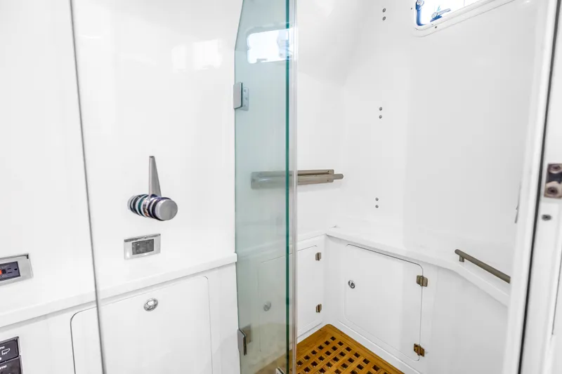 Slide: The Image of 2023 HCB 53 Suenos RXV yacht bathroom with glass shower and wooden floor. - 81