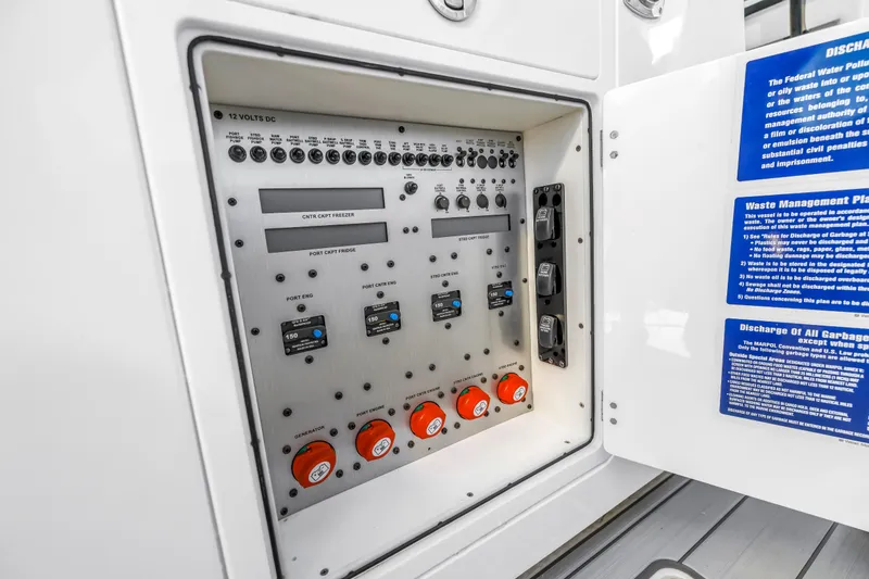 Slide: The Image of Control panel of 2023 HCB 53 Suenos RXV boat with switches and waste management instructions. - 97