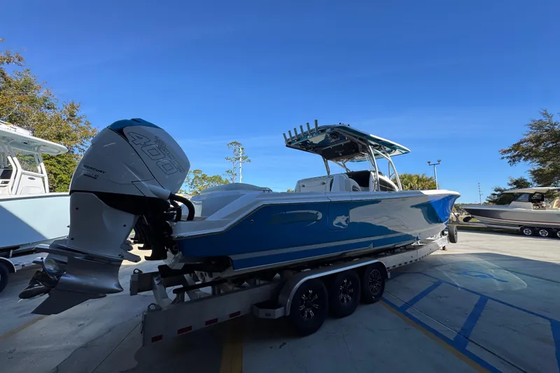 Slide: The Image of 2016 Nor-Tech 390 Sport Center Console boat with Mercury 400 engine on trailer. - 12