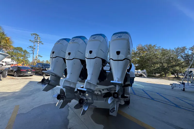 Slide: The Image of 2016 Nor-Tech 390 Sport Center Console with four powerful outboard engines. - 14