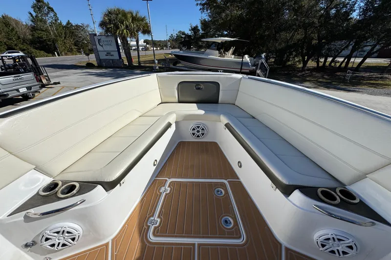 Slide: The Image of 2016 Nor-Tech 390 Sport Center Console boat interior with white seating and teak flooring. - 19