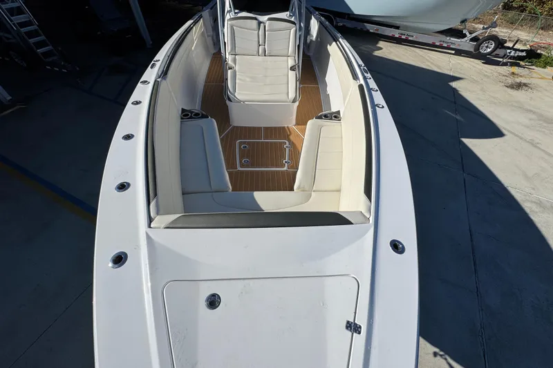 Slide: The Image of 2016 Nor-Tech 390 Sport Center Console boat with spacious seating and sleek design. - 21