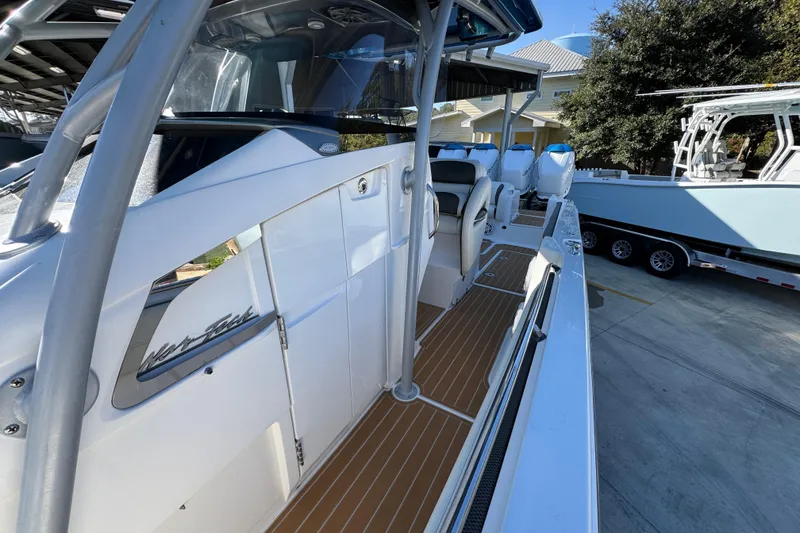 Slide: The Image of 2016 Nor-Tech 390 Sport Center Console boat with sleek design and spacious deck. - 26