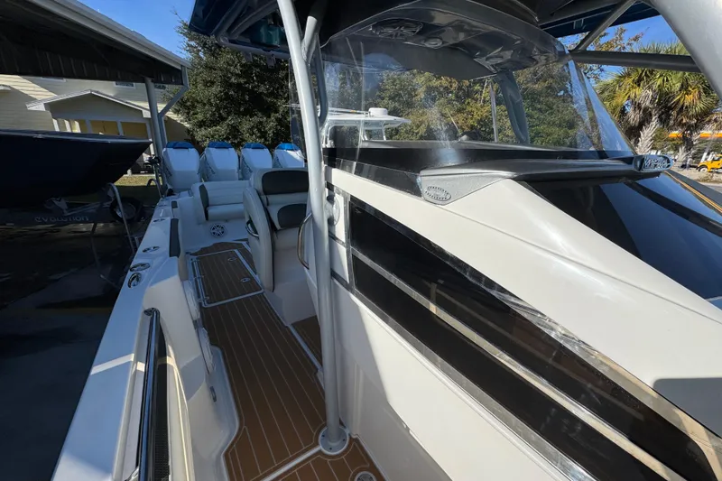 Slide: The Image of 2016 Nor-Tech 390 Sport Center Console boat with sleek design and spacious seating. - 27