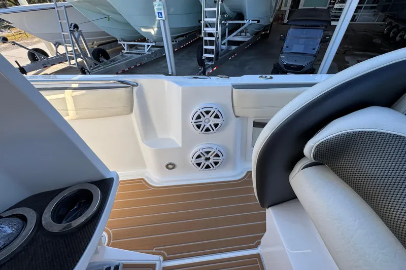 Slide: The Image of 2016 Nor-Tech 390 Sport Center Console interior with speakers and seating. - 32