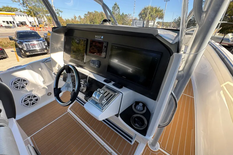 Slide: The Image of 2016 Nor-Tech 390 Sport Center Console helm with modern controls and dual displays. - 36