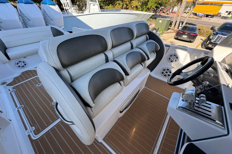 Slide: The Image of 2016 Nor-Tech 390 Sport Center Console interior with plush seating and modern controls. - 37