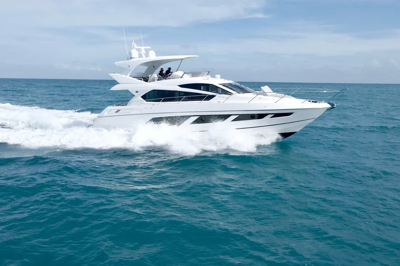 The Image of 2017 Sunseeker Manhattan 65 yacht cruising on open sea under clear skies. - 0