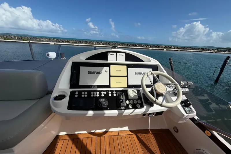 Slide: The Image of Helm of 2017 Sunseeker Manhattan 65 yacht with Simrad navigation system, docked by the sea. - 10