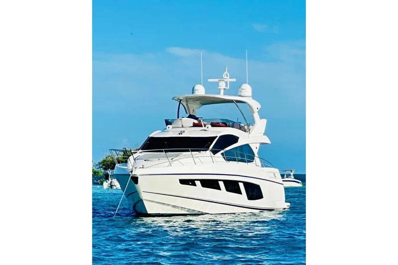 Slide: The Image of 2017 Sunseeker Manhattan 65 yacht on blue ocean under clear sky. - 6