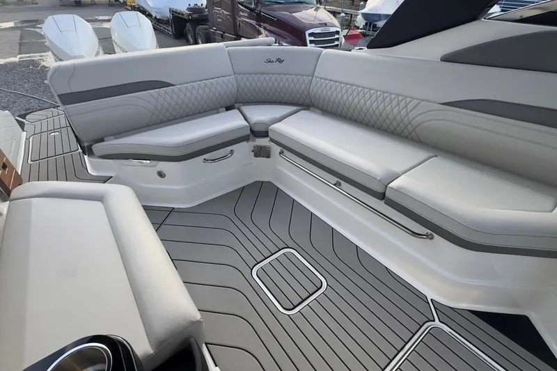 Slide: The Image of Interior of 2026 Sea Ray SLX 280 Outboard with gray upholstery. - 19