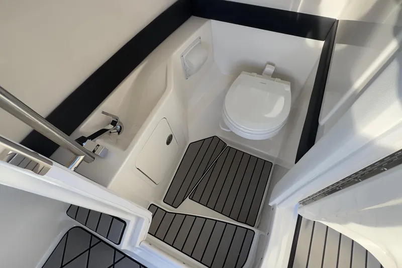 Slide: The Image of Interior of 2026 Sea Ray SLX 280 Outboard with toilet. - 33
