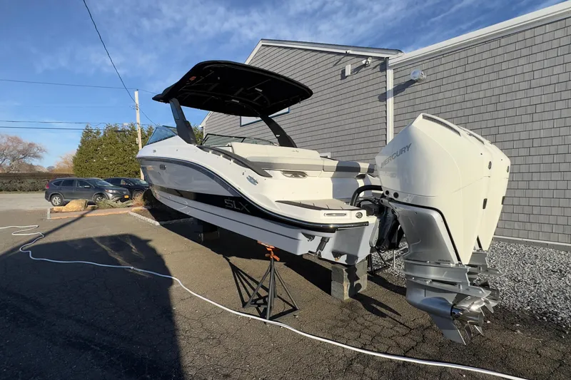 Slide: The Image of 2026 Sea Ray SLX 280 Outboard on a parking lot. - 5
