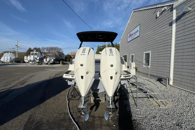 Slide: The Image of 2026 Sea Ray SLX 280 Outboard with dual V8 engines outdoors. - 6