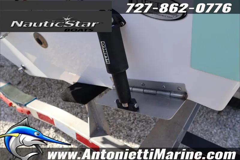 Slide: The Image of 2026 NauticStar 222 Offshore boat on trailer, featuring Lenco trim tab. - 10