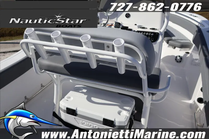 Slide: The Image of 2026 NauticStar 222 Offshore boat interior with rod holders and cooler, Antonietti Marine branding. - 16
