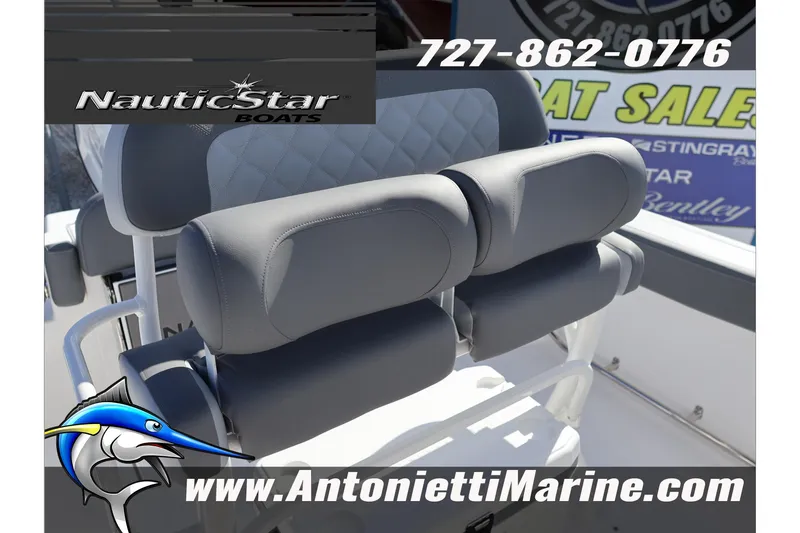 Slide: The Image of 2026 NauticStar 222 Offshore boat seating, featuring gray upholstery and diamond stitching. - 26