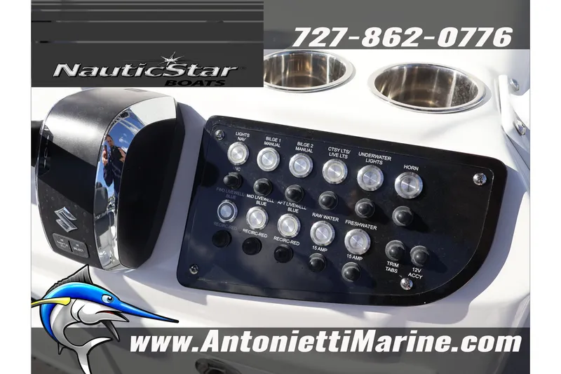 Slide: The Image of Control panel of 2026 NauticStar 222 Offshore boat with switches and logo. - 28