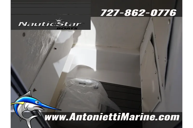 Slide: The Image of 2026 NauticStar 222 Offshore interior detail, featuring storage compartment. Visit AntoniettiMarine.com. - 48