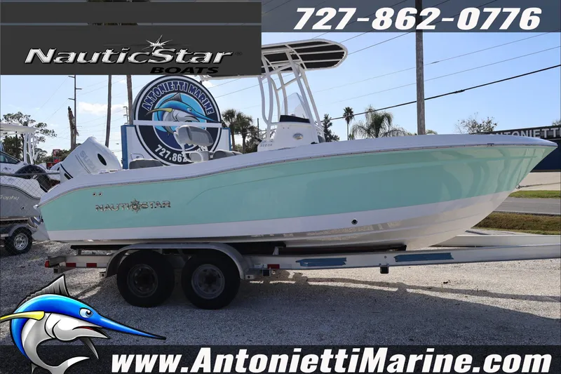 Slide: The Image of 2026 NauticStar 222 Offshore boat on trailer at Antonietti Marine dealership. - 6