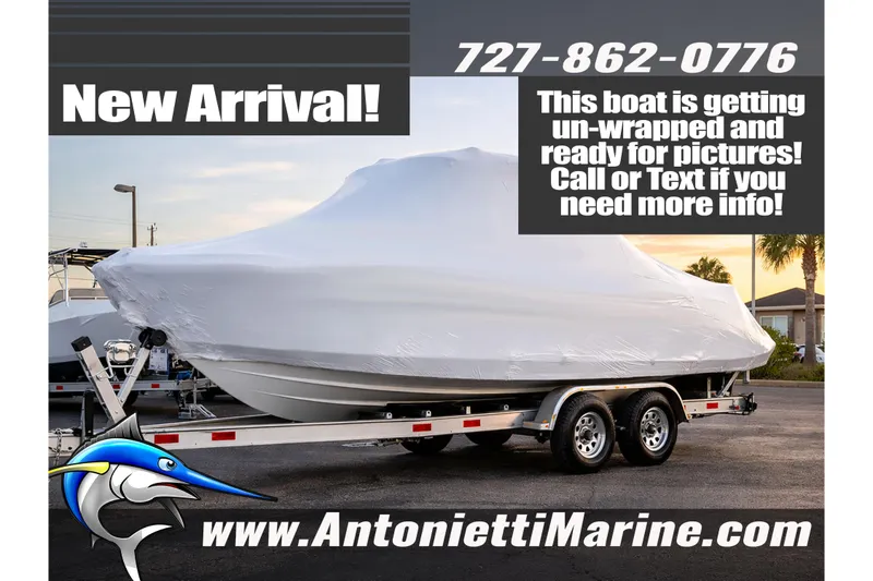 Slide: The Image of 2026 NauticStar 222 Offshore boat on trailer at Antonietti Marine dealership. - 1