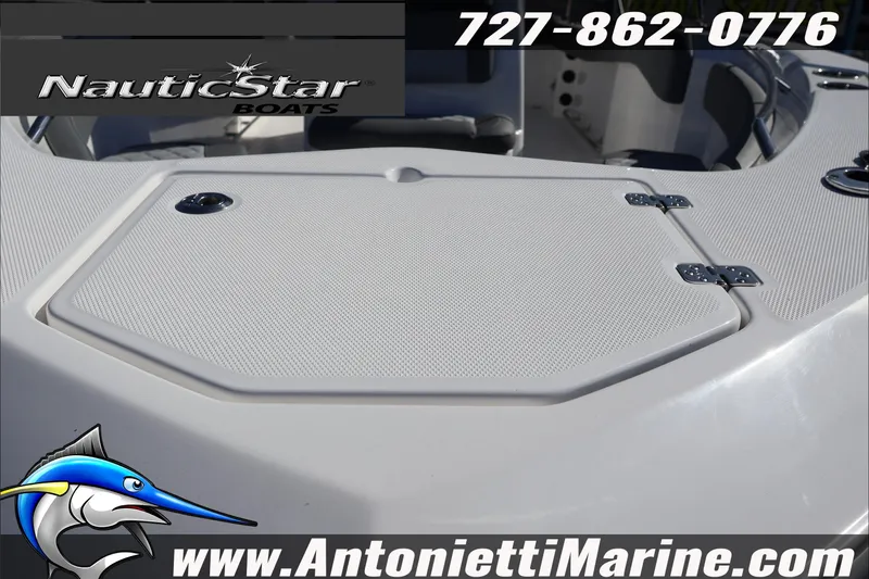 Slide: The Image of 2026 NauticStar 222 Offshore boat deck, featuring storage hatch and branding details. - 10