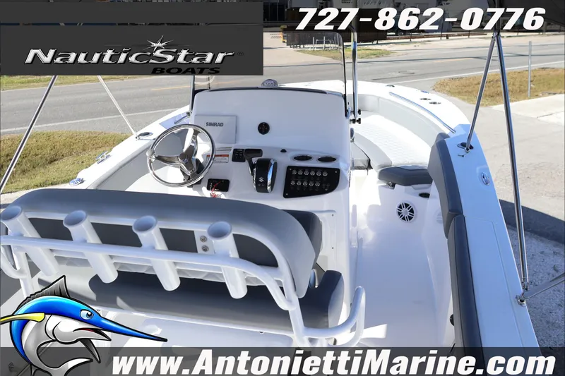 Slide: The Image of 2026 NauticStar 222 Offshore boat interior with steering wheel and seating, Antonietti Marine branding. - 14