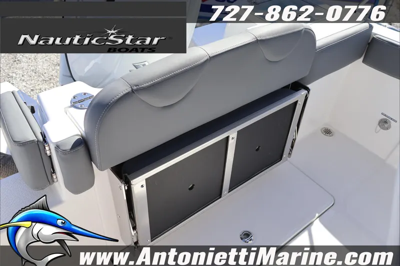 Slide: The Image of 2026 NauticStar 222 Offshore boat interior with seating and storage, featuring marine branding. - 15