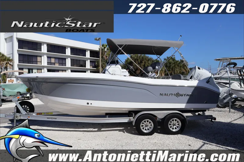Slide: The Image of 2026 NauticStar 222 Offshore boat on trailer at Antonietti Marine dealership. - 2