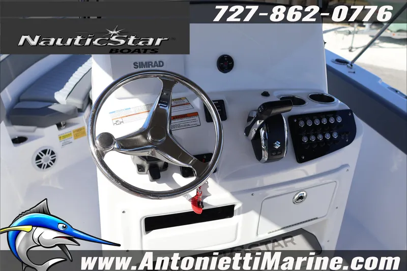 Slide: The Image of Steering console of 2026 NauticStar 222 Offshore boat with controls and branding. - 22
