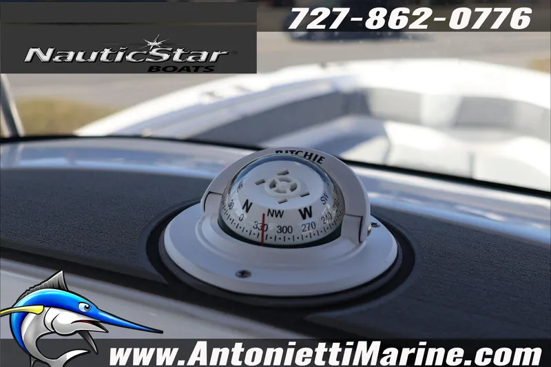Slide: The Image of Compass on NauticStar 222 Offshore boat dashboard, 2026 model, with contact details and logo. - 28
