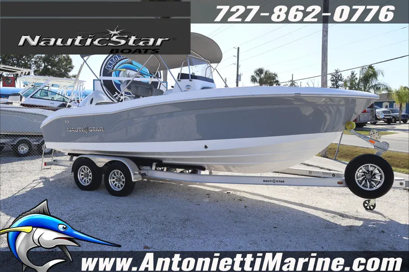 Slide: The Image of 2026 NauticStar 222 Offshore boat on trailer at Antonietti Marine dealership. - 3