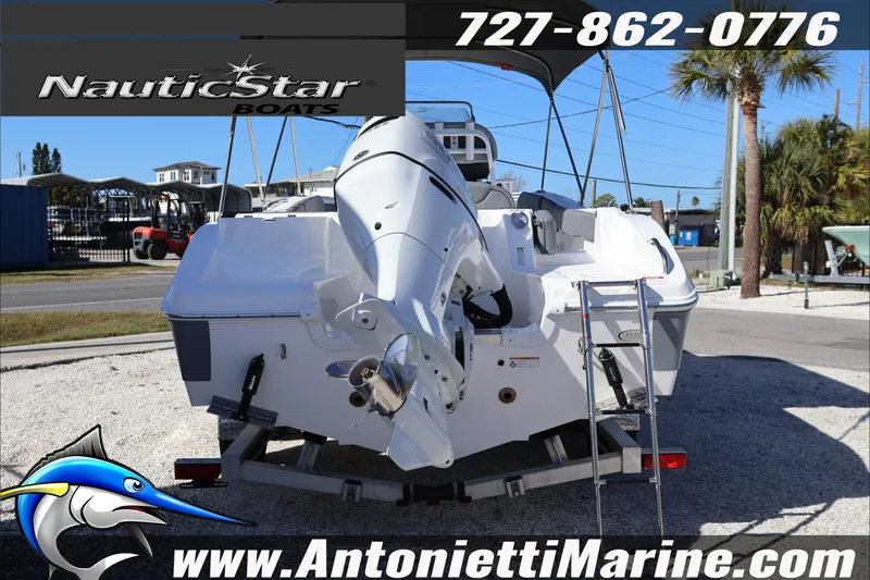 Slide: The Image of 2026 NauticStar 222 Offshore boat rear view with outboard motor and ladder. - 4