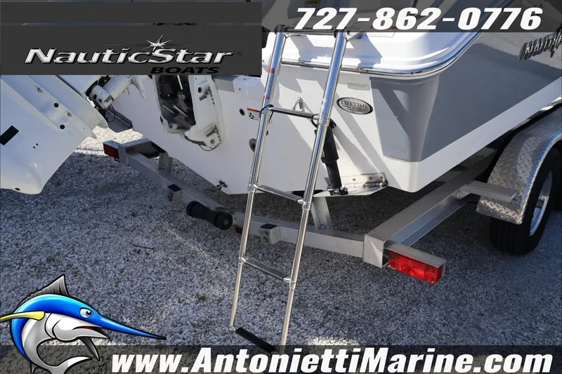 Slide: The Image of 2026 NauticStar 222 Offshore boat on trailer with ladder, displayed by Antonietti Marine. - 5
