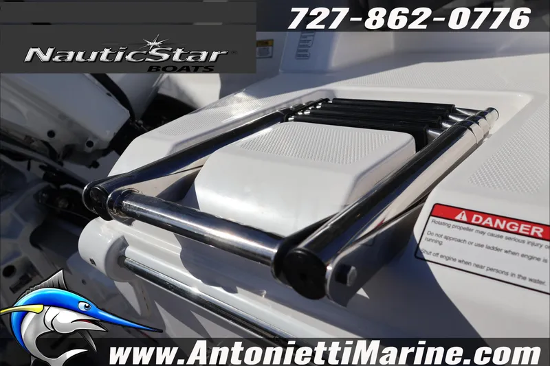 Slide: The Image of 2026 NauticStar 222 Offshore boat ladder with safety warning and contact details. - 6