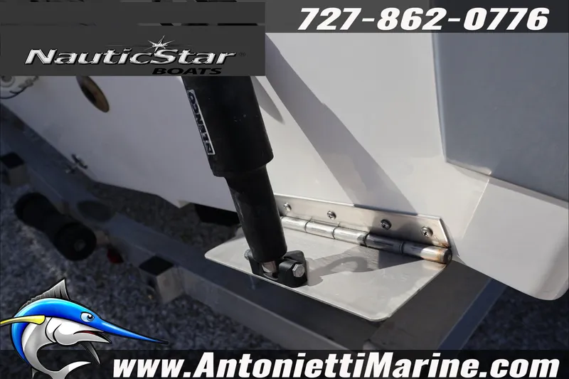 Slide: The Image of Close-up of 2026 NauticStar 222 Offshore boat hinge and hydraulic component. - 7