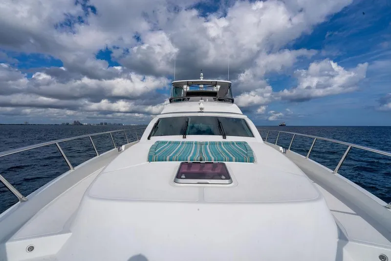 Slide: The Image of Luxurious bedroom interior on Lanzarote Ventuno 73 yacht, featuring striped bedding and modern design. - 61