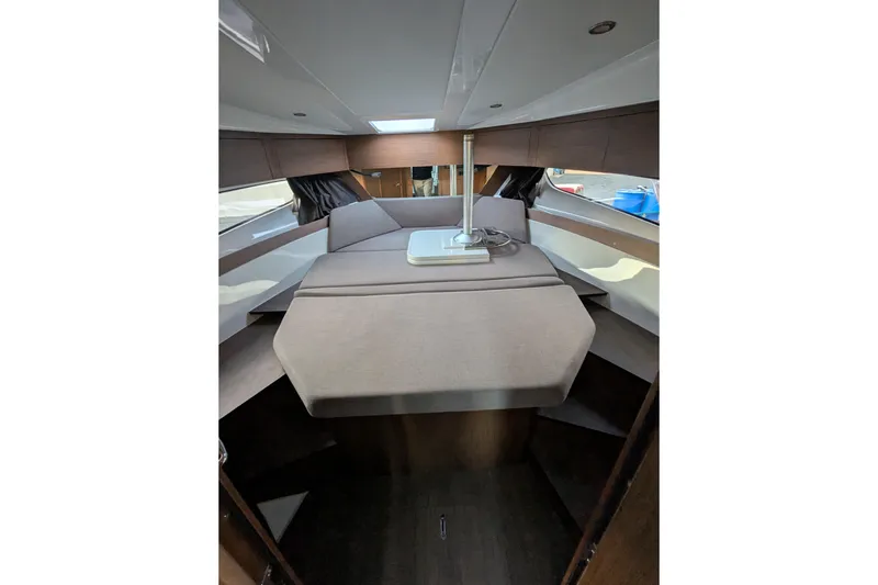 Slide: The Image of Interior cabin of 2024 Beneteau Antares 11 with modern seating and table. - 20