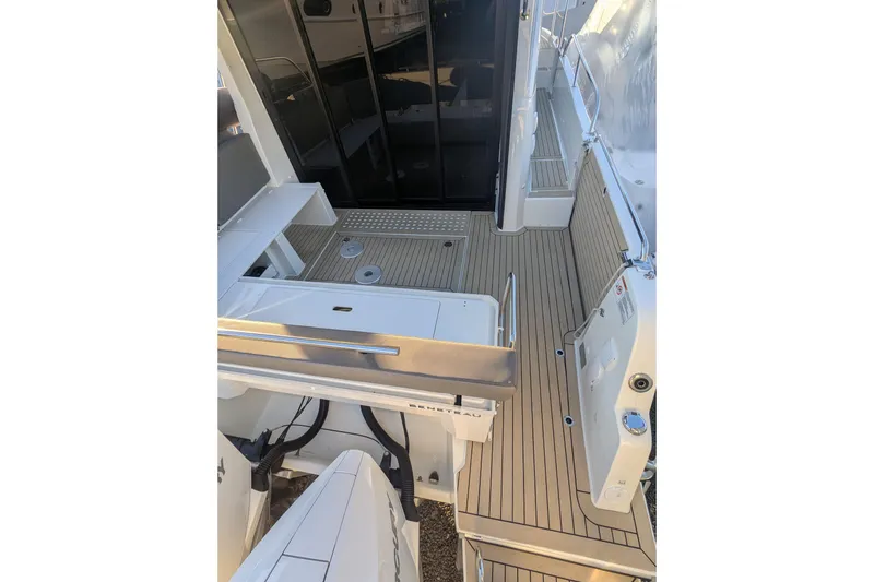 Slide: The Image of 2024 Beneteau Antares 11 boat deck with sleek, modern design and wood finish. - 3