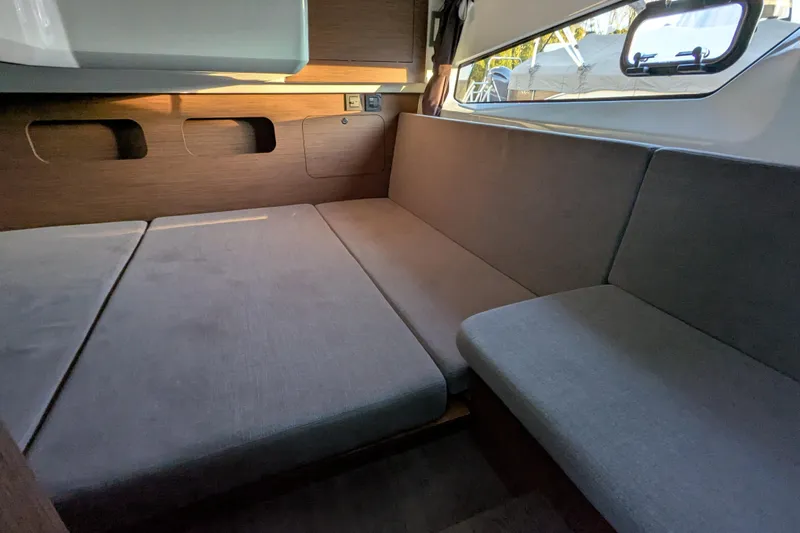 Slide: The Image of 2024 Beneteau Antares 11 cabin interior with cozy bed and modern design. - 6